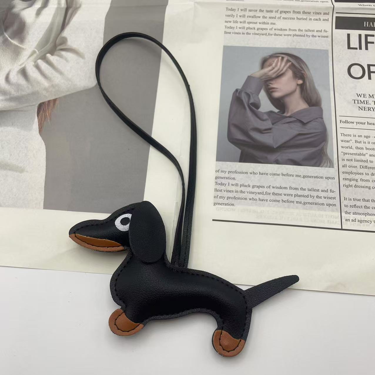 Handcrafted faux leather Dachshund dog bag charm in macaron color palette.