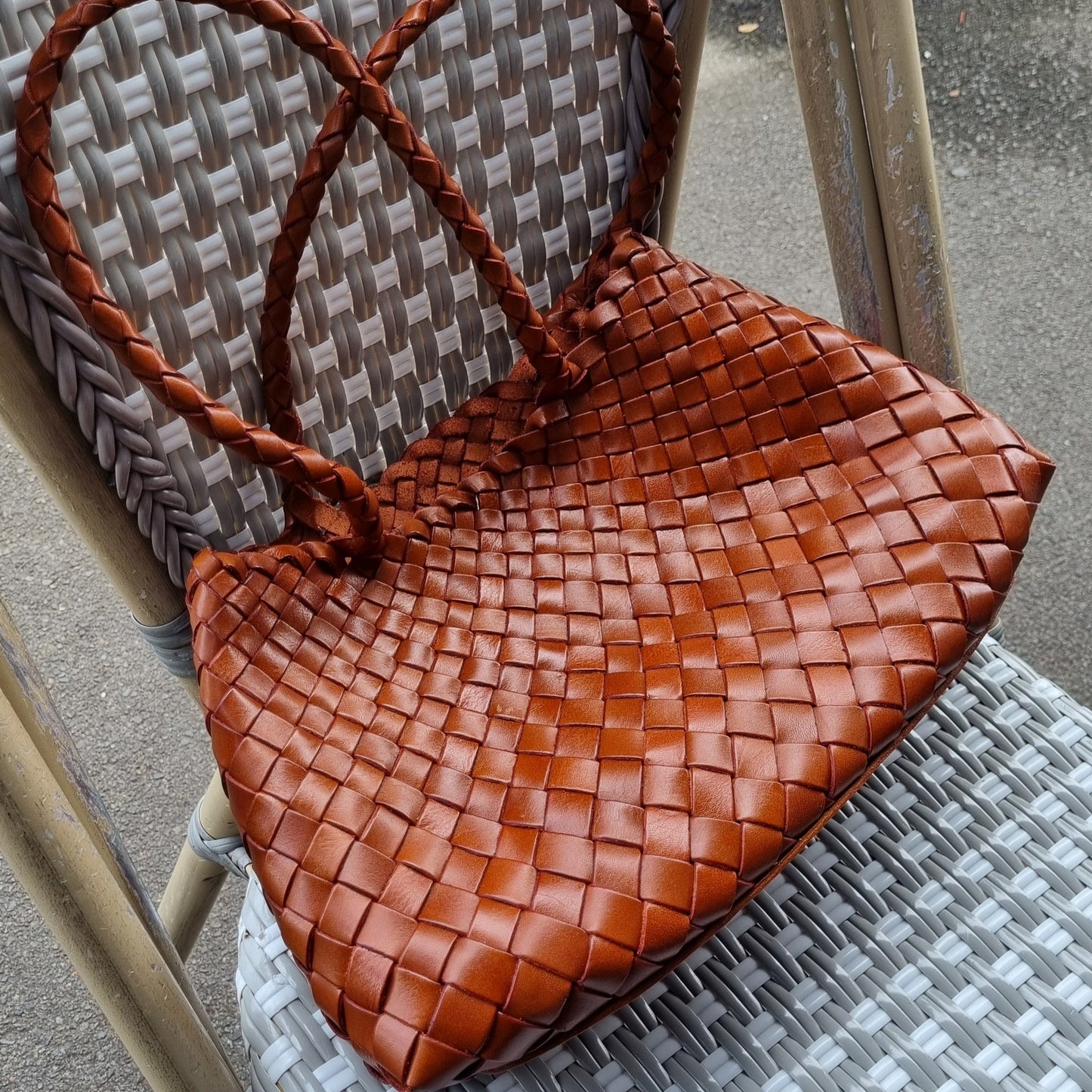 brown opal woven bag on a chair