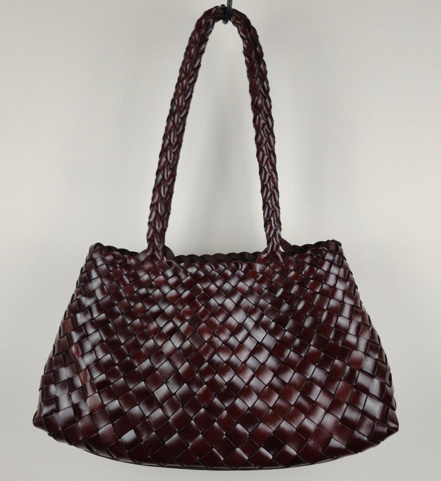 Woven coffee handbag on a light gray background
