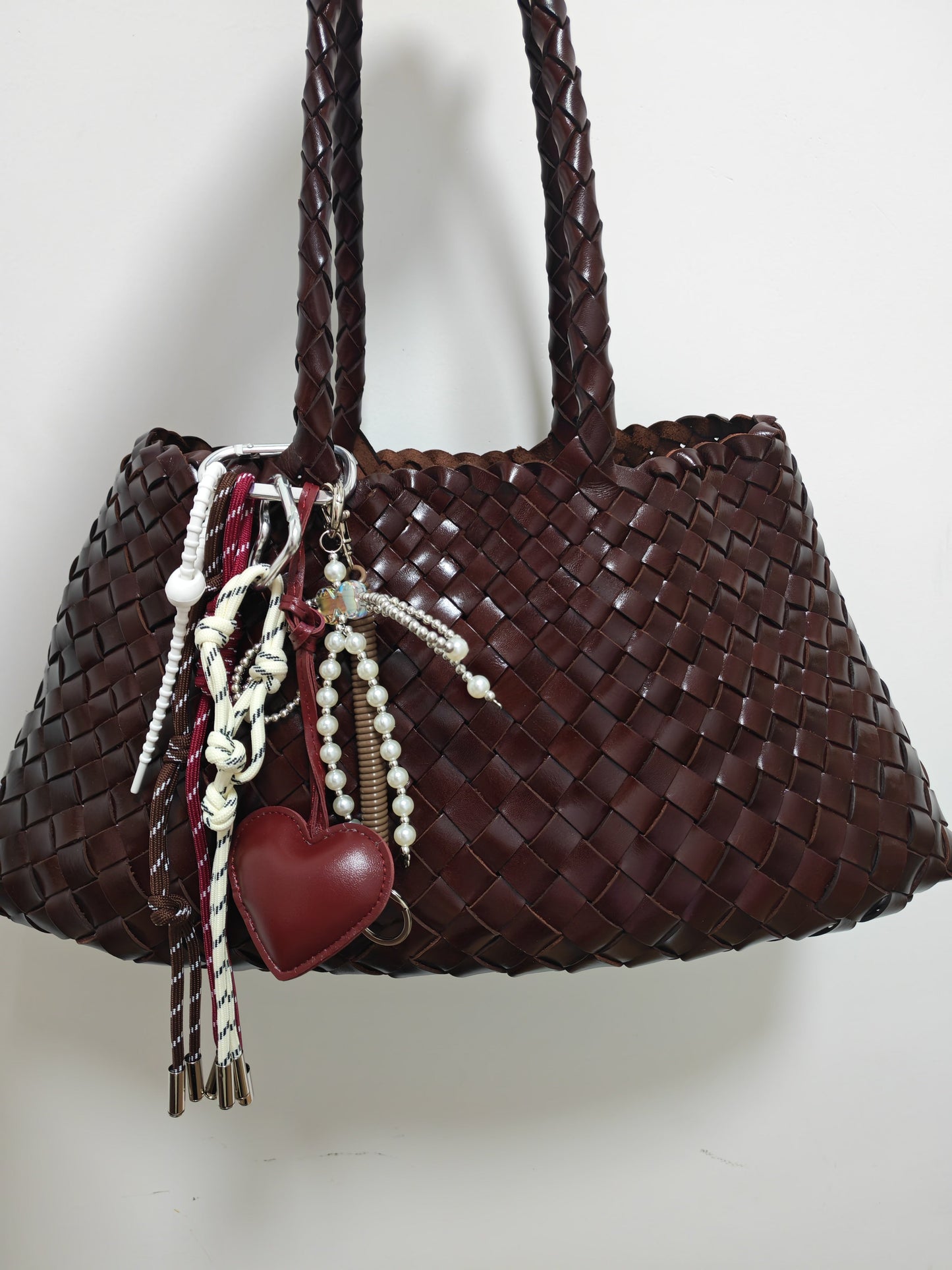 Lulu Luxe Charm multicolor faux leather bag charm and key ring on brown woven handbag