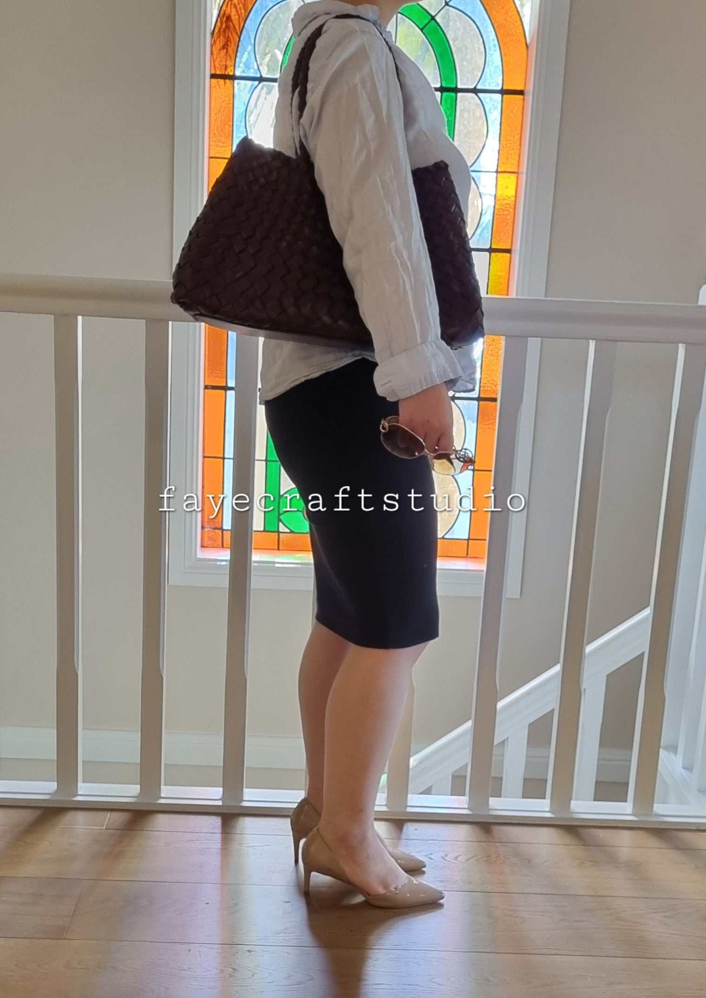 Model side View Of Leah Large Handmade Leather Woven Tote Bag with Long Handles in Coffee Leather