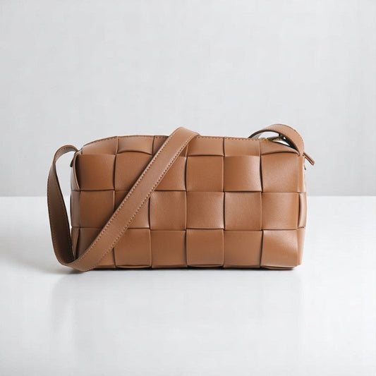 Melbourne - Woven Camera Bag made of brown genuine cowhide leather with adjustable shoulder strap.