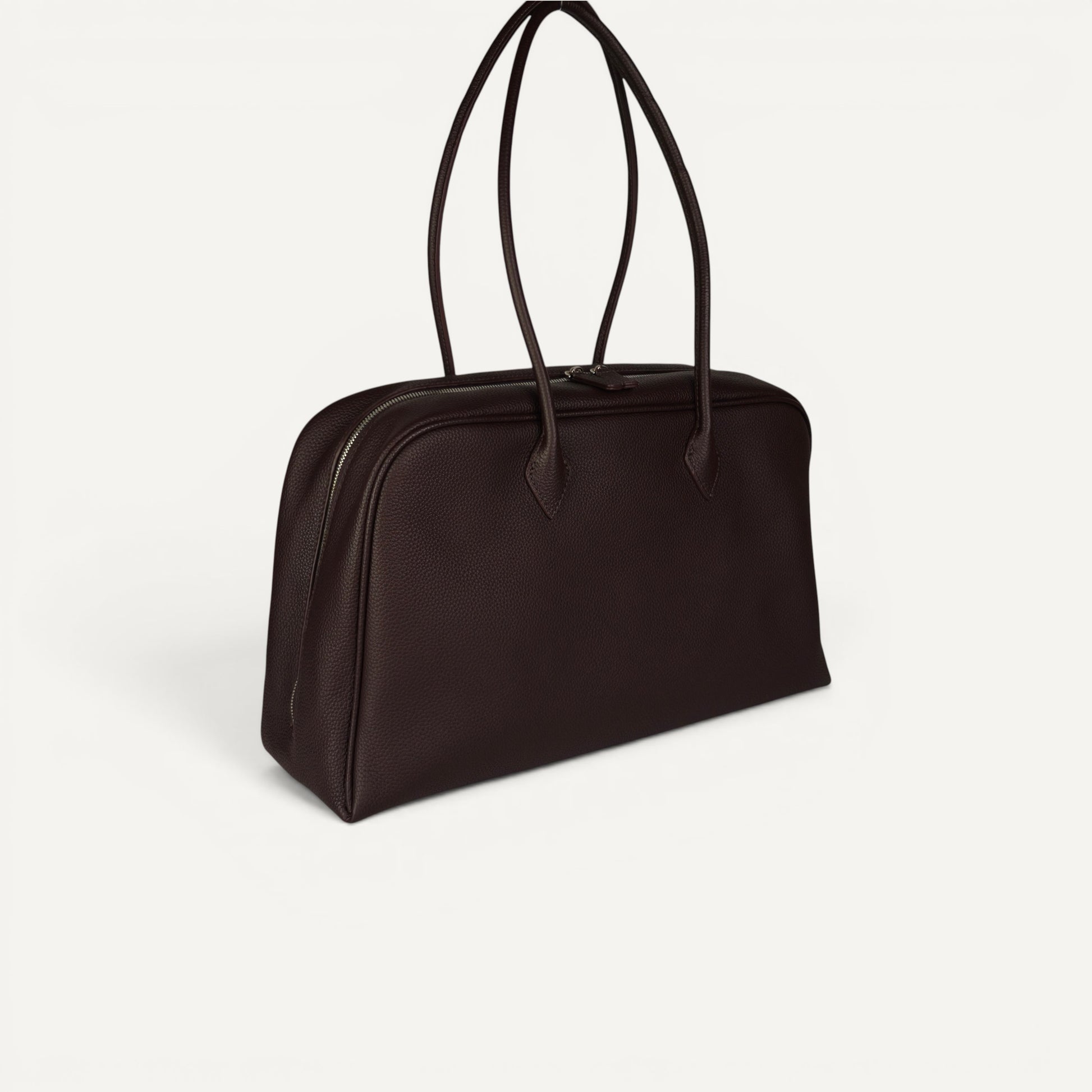 Belle coffee brown full-grain leather shoulder bag with elongated double straps and soft structured silhouette