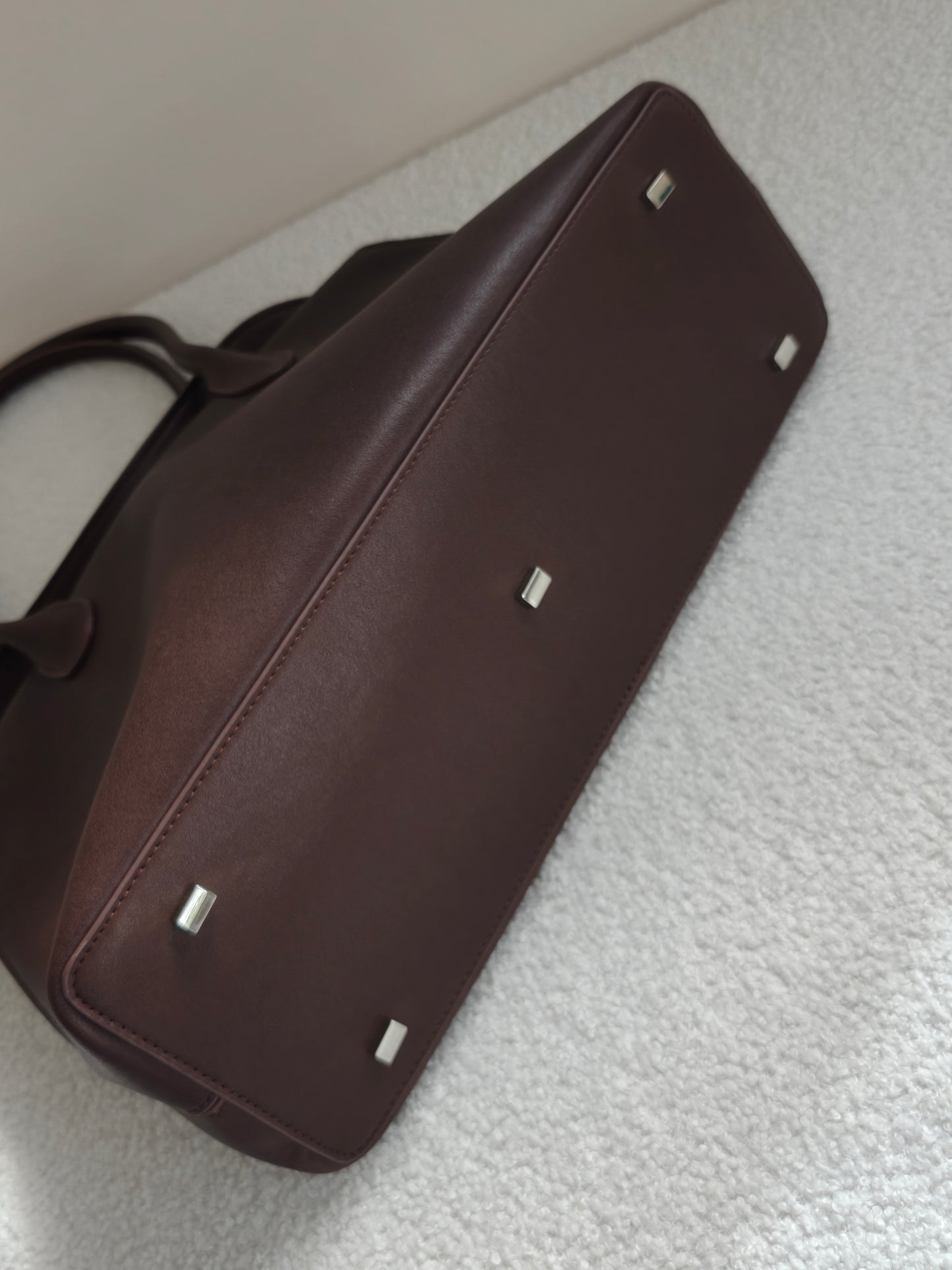 coffee valentina bag with metal feet at the base