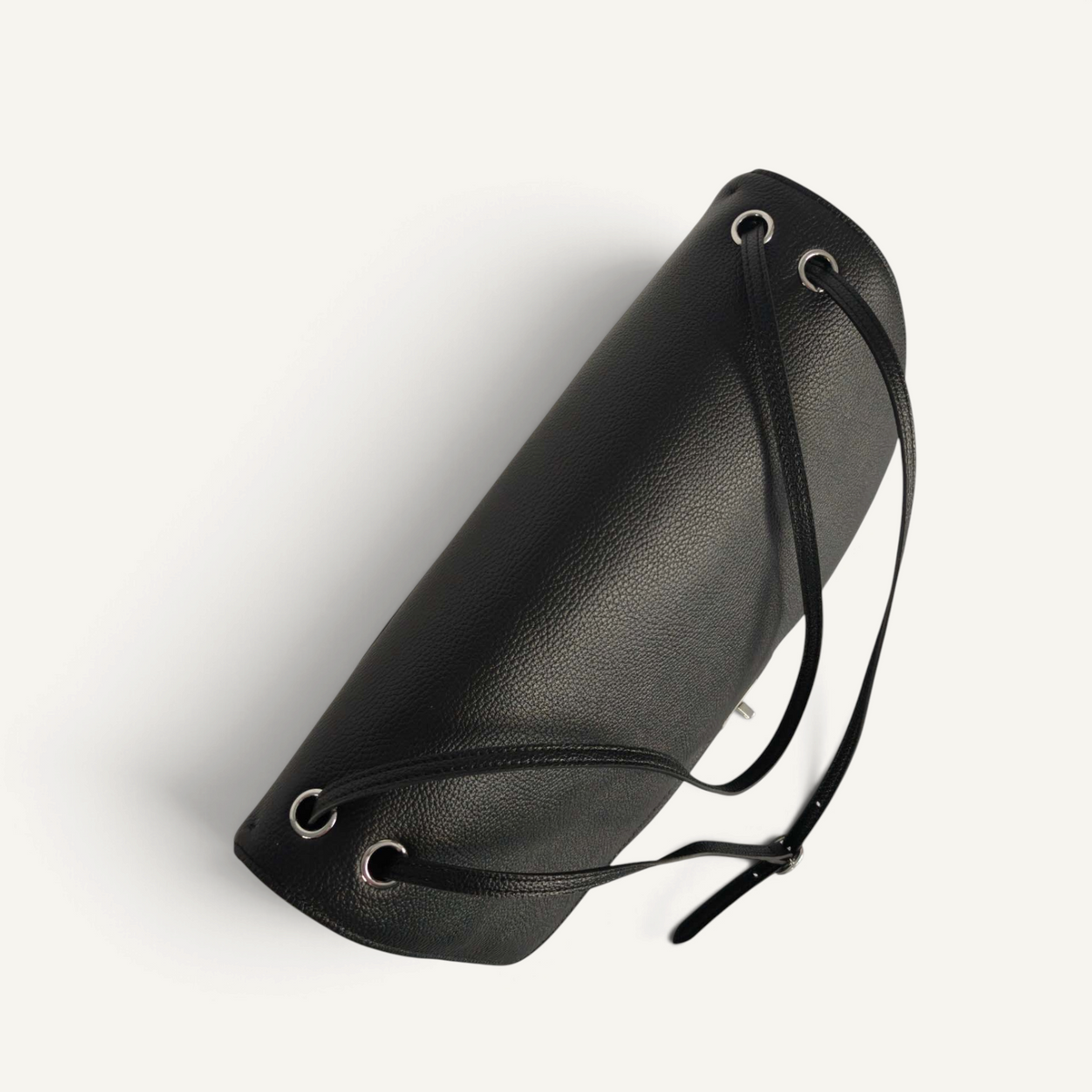 Fayecreations large black leather cylindrical bag with silver metal eyelet details and adjustable shoulder straps