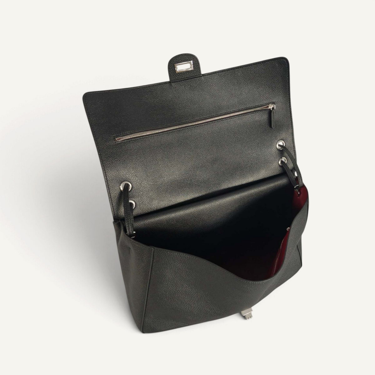 Fayecreations large black leather bag with a flap closure, silver hardware, and a deep red interior lining.