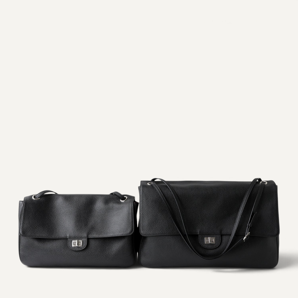 Two Fayecreations Eleanor black genuine leather shoulder bags with turn-lock closures and double straps.