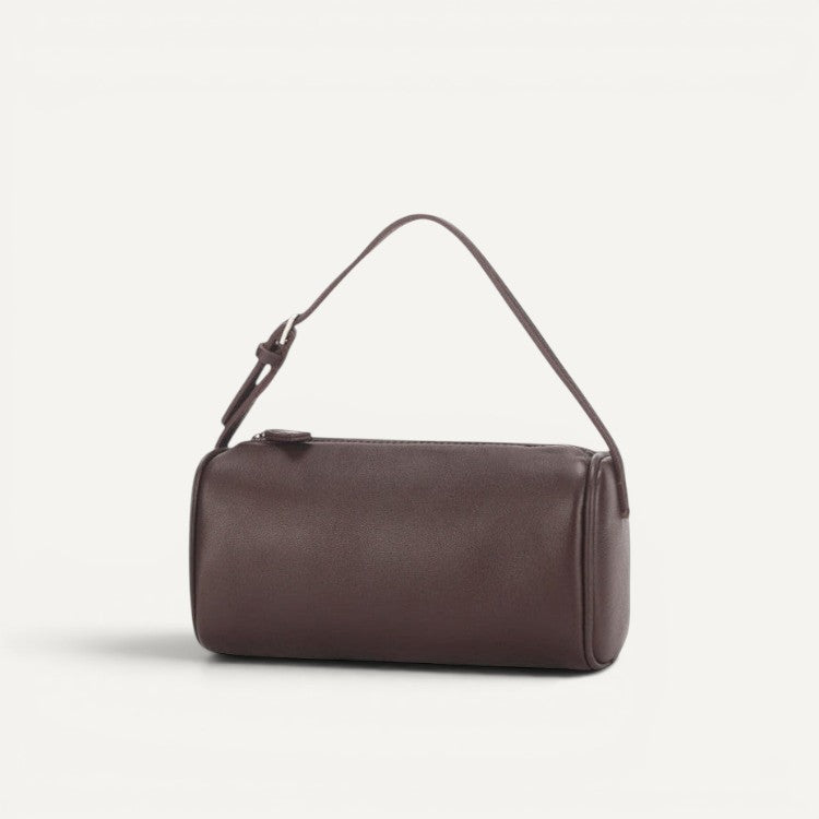 Alana Hand-Carry Leather Bag in genuine cowhide leather with sleek cylinder design and top zipper closure