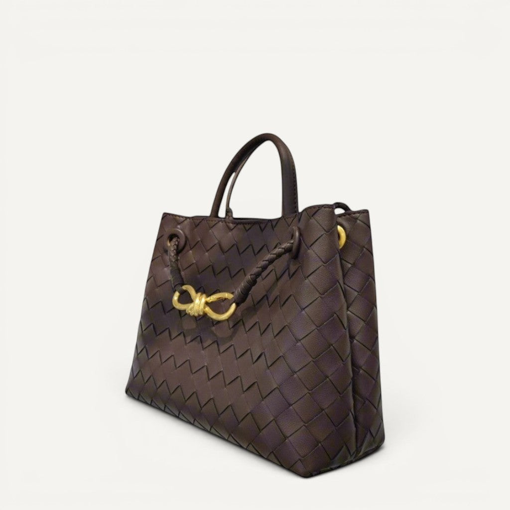 Sleek Jade tote bag with crosswoven leather design and gold-tone hardware, compact and elegant for versatile hand, shoulder, or crossbody carry.