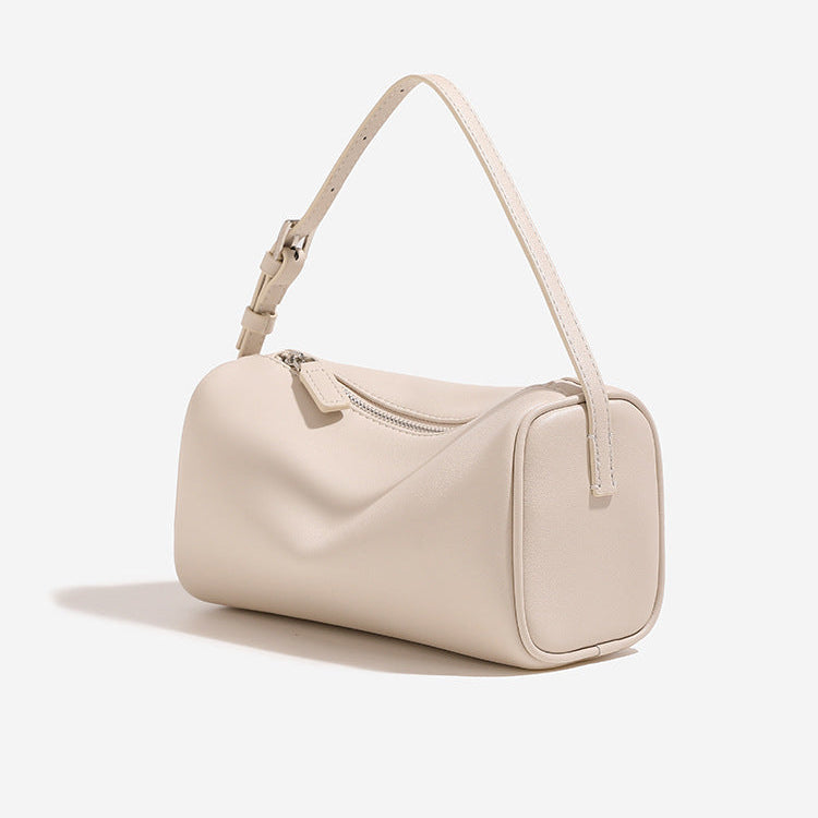 Beige handbag on a white background