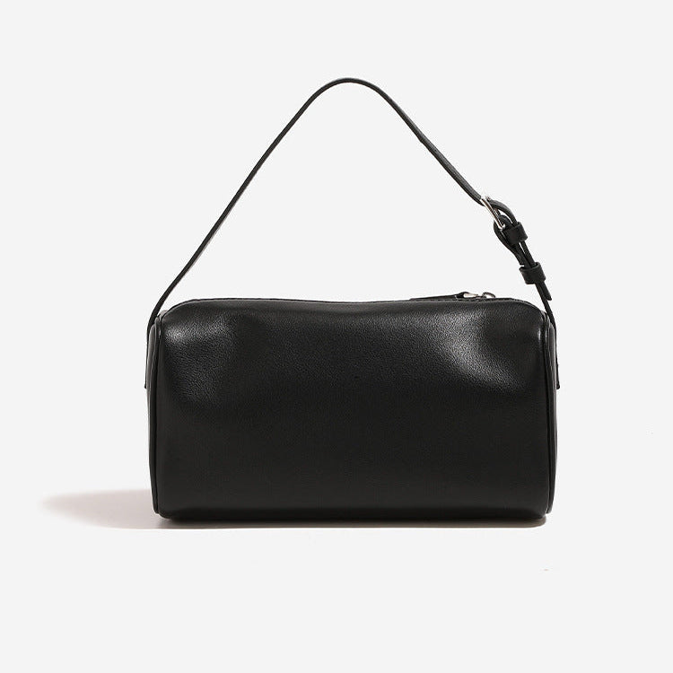 Alana Hand-Carry Leather Bag in genuine cowhide leather with sleek cylindrical design and detachable strap for versatile use