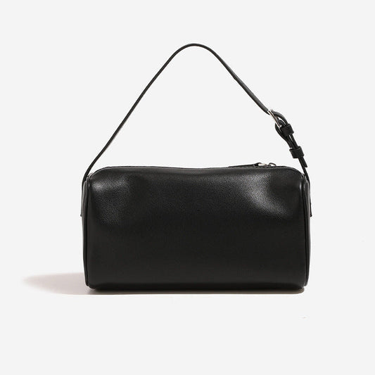 Alana Hand-Carry Leather Bag in genuine cowhide leather with sleek cylindrical design and detachable strap for versatile use