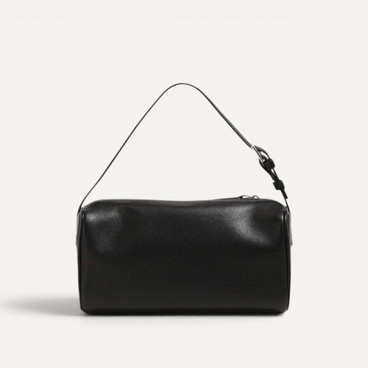 Alana Hand-Carry Leather Bag in genuine cowhide leather with sleek cylindrical design and detachable strap for versatile use