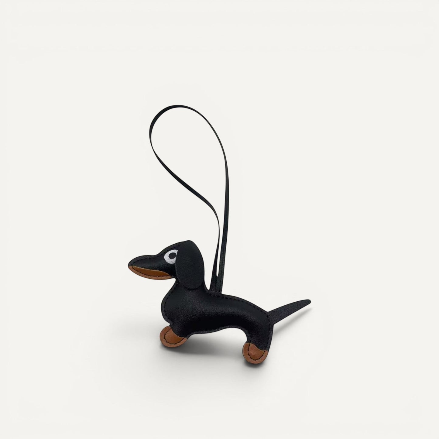 Handcrafted faux leather Dachshund dog bag charm in macaron color palette.