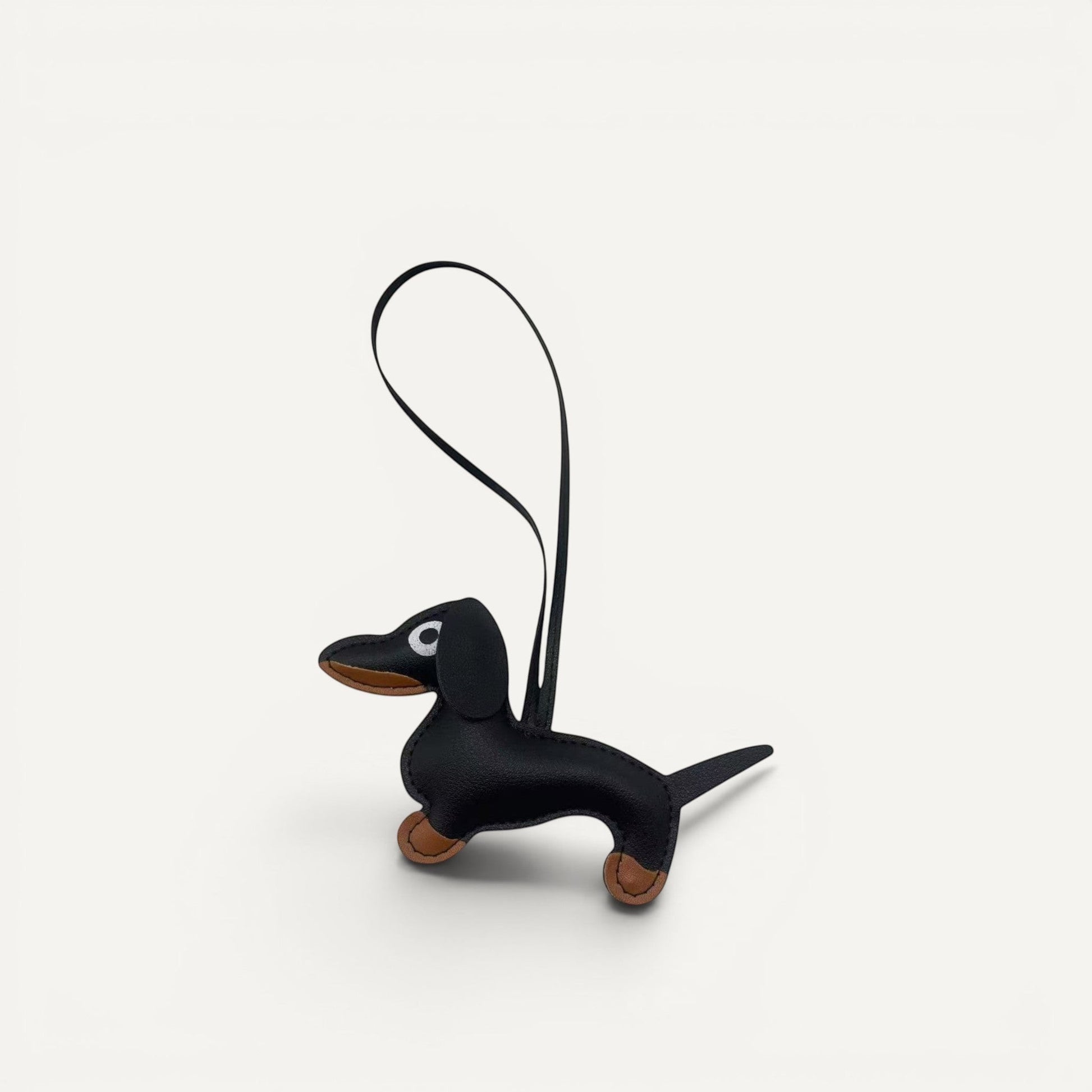 Handcrafted faux leather Dachshund dog bag charm in macaron color palette.