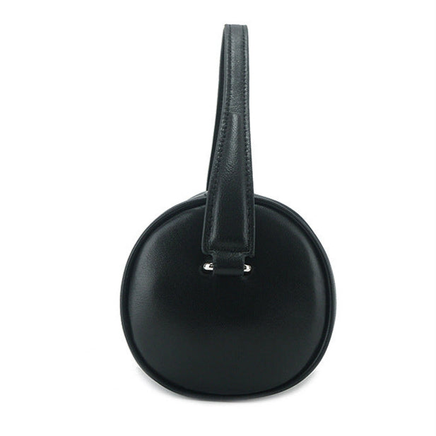 Alana - Minimalist Genuine Leather Cylinder Bag in black, showcasing cylindrical design and premium leather finish.