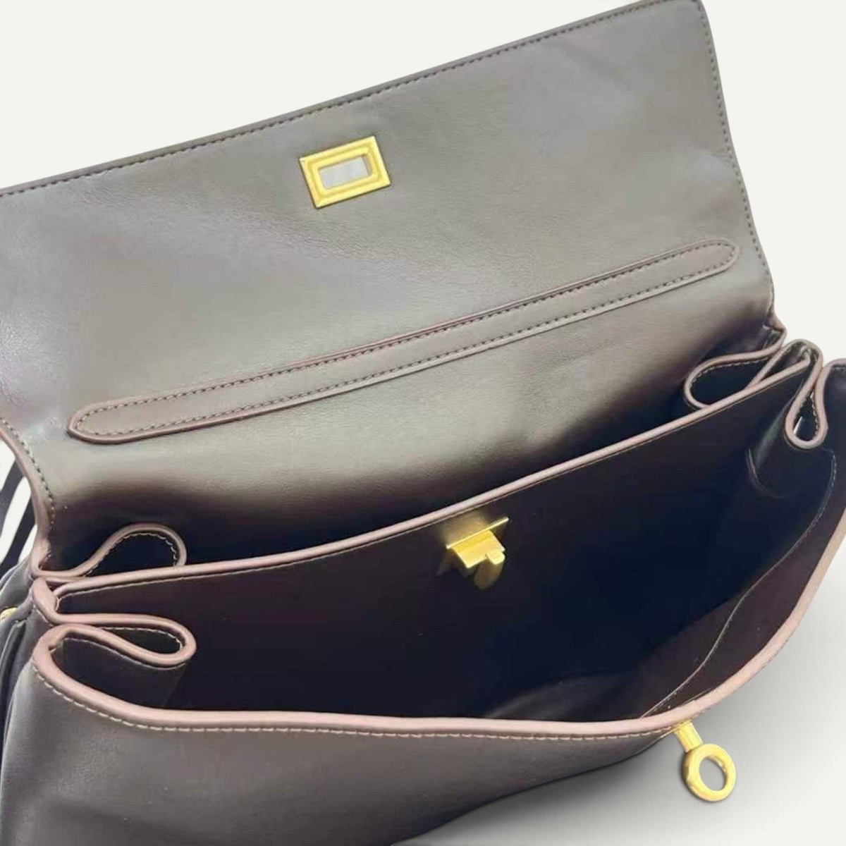 Fayecreations Harper small brown leather shoulder bag interior with secure gold lock closure and microfiber lining.