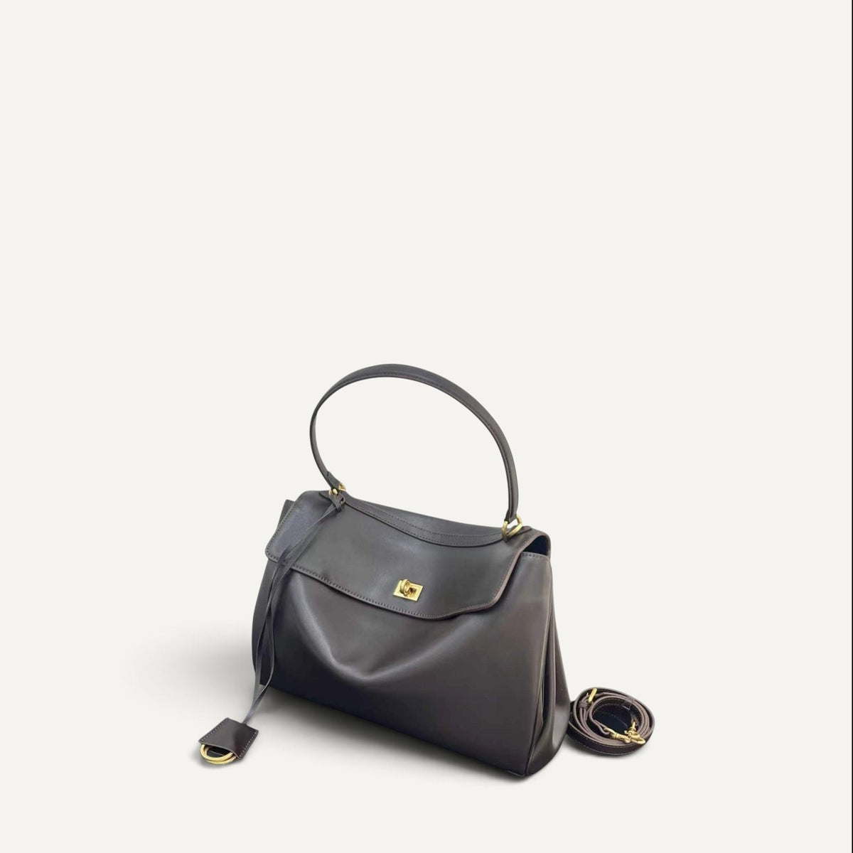 Fayecreations Harper small structured dark grey cowhide leather shoulder bag with gold lock and detachable strap.