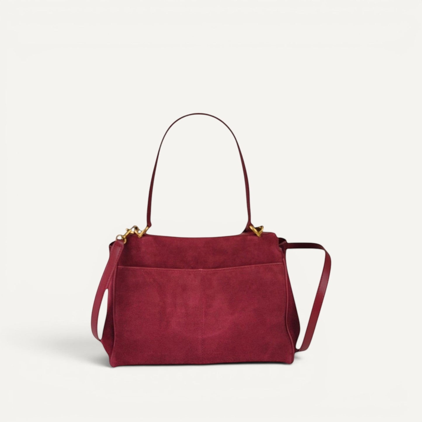 burgundy handbag with a shoulder strap on a white background