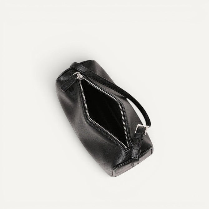 Black leather bag with a zipper on a white background