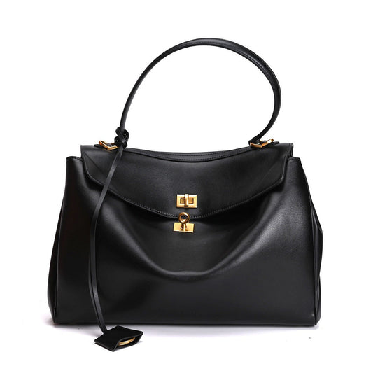 Large black leather shoulder bag with secure lock closure and comfortable strap, suitable for commuters and professionals.