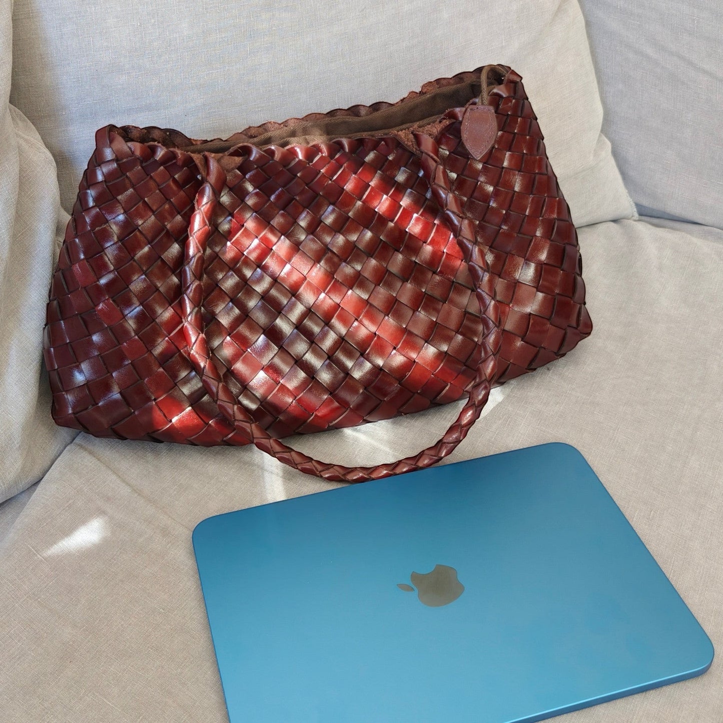 Opal City Zip woven leather tote bag next to 11-inch iPad showing size comparison