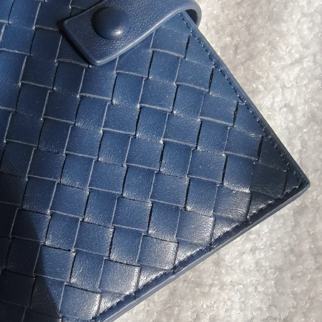 navy passport holder close up shot showing leather texture