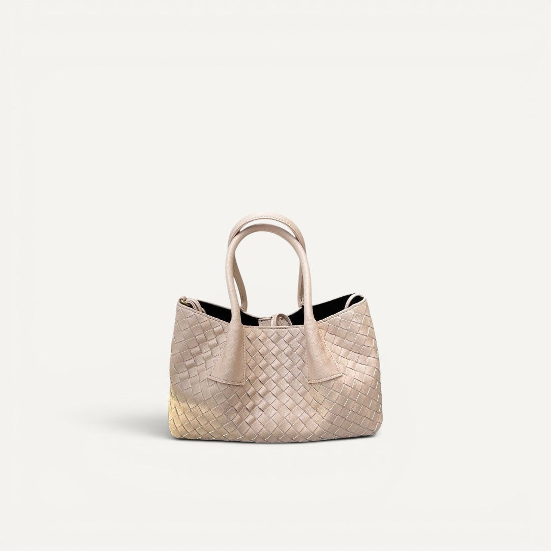 Beige woven handbag on a white background
