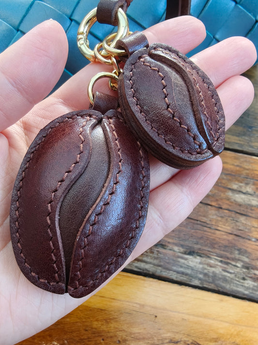Handmade Coffee Bean Charm crafted from premium full grain leather, hand-cut and stitched for handbags or keychains.