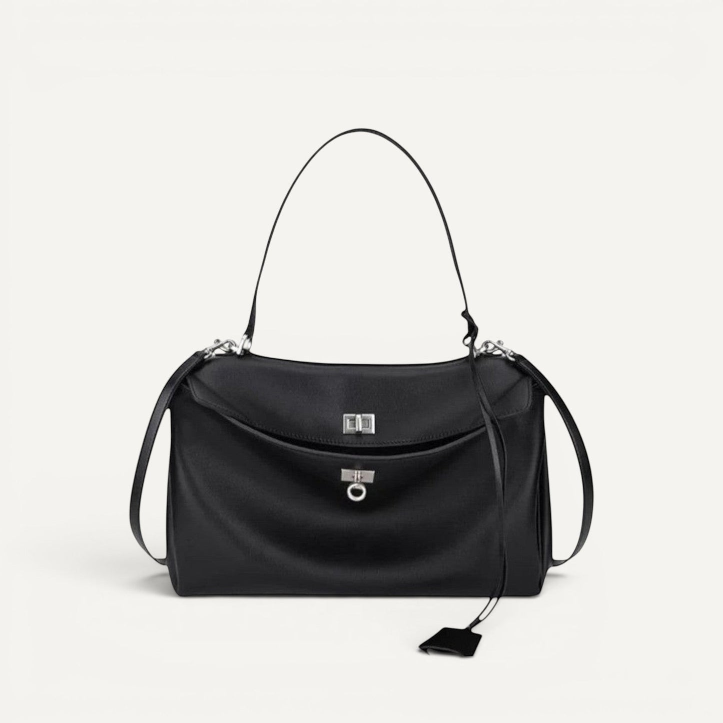 Harper shoulder bag in genuine leather with secure lock closure, spacious interior, and comfortable shoulder straps for casual commuters