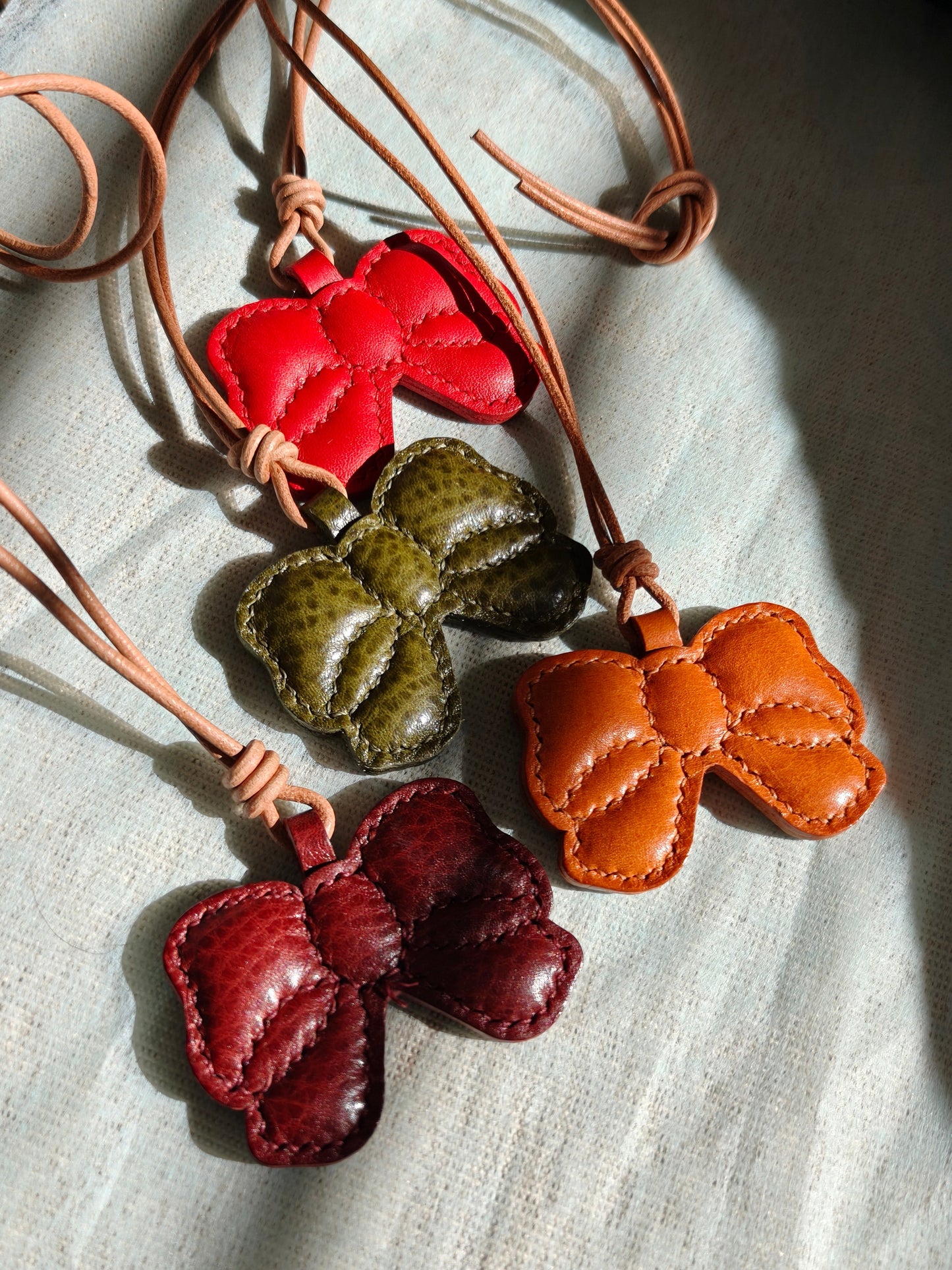 Handmade butterfly charm in colorful full grain leather.