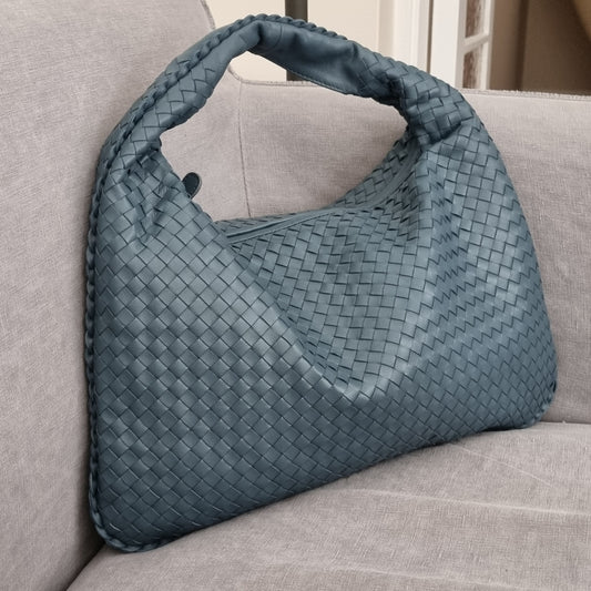 Handwoven sheepskin leather hobo bag, soft blue, substantial interior space.