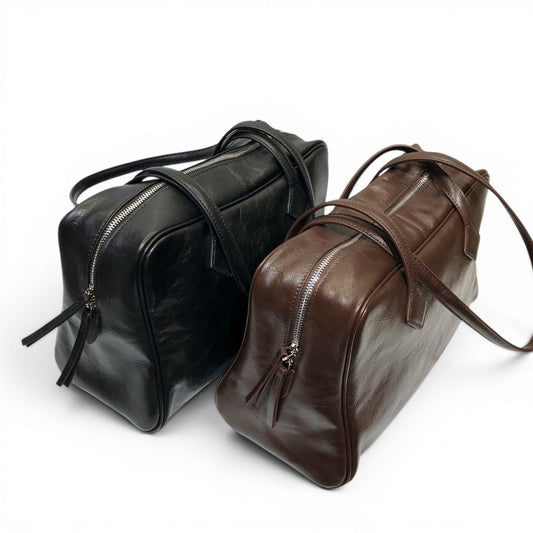 Box 35 structured tote bag made of premium full-grain leather with triple-zip compartments and smooth fabric lining