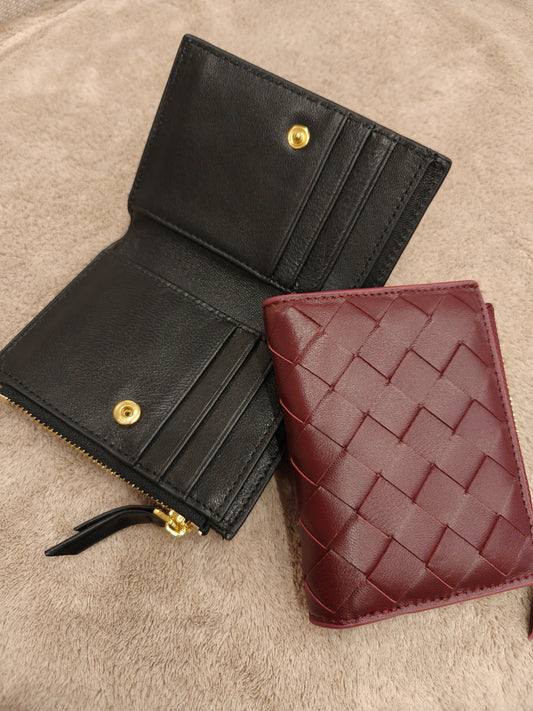 Lola Sheepskin Woven Short Wallet in black and red, showcasing open and closed views with card slots and woven pattern.