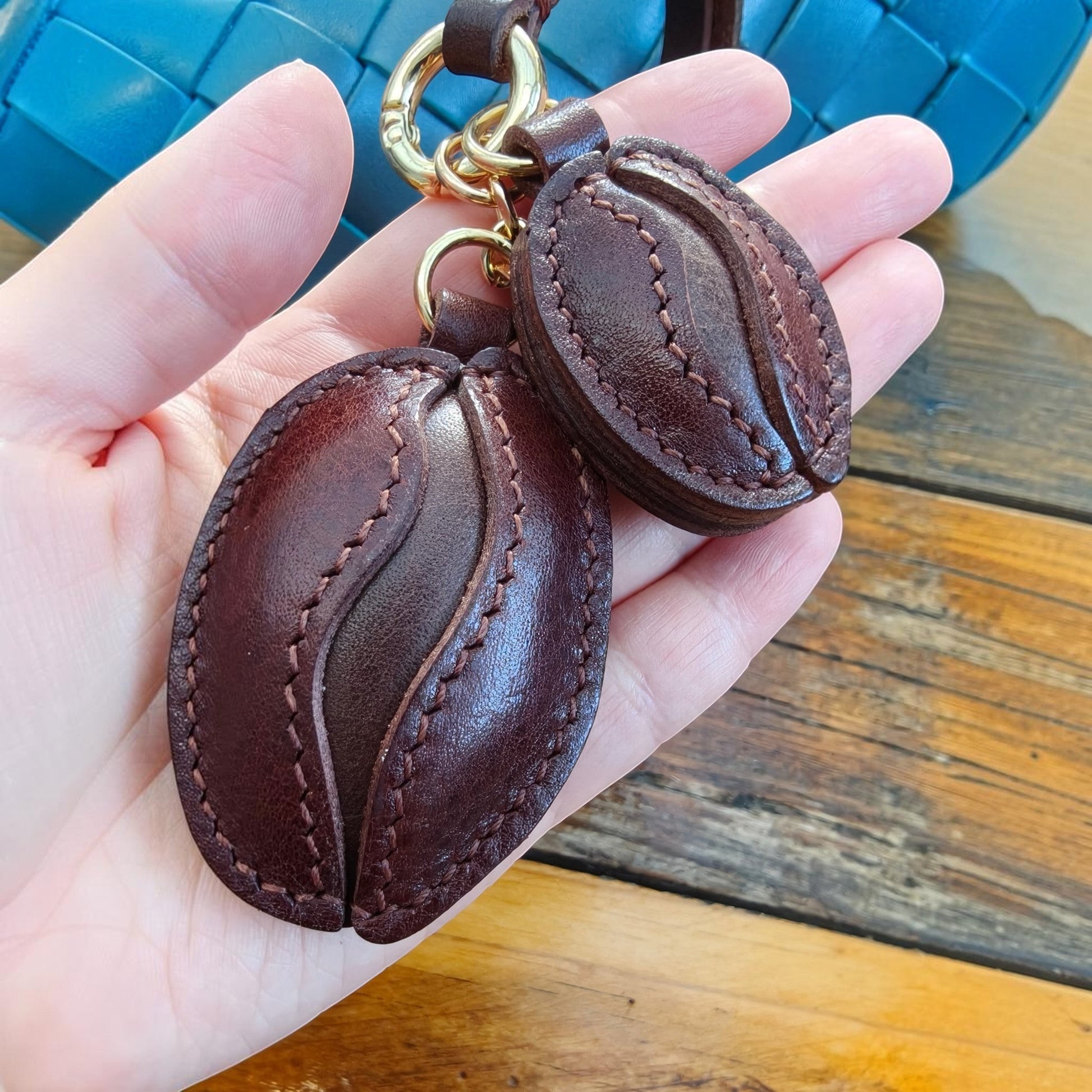 Handmade Coffee Bean Charm crafted from premium full grain leather, hand-cut and stitched for handbags or keychains.